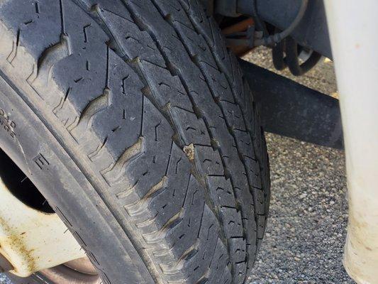 A plug that was not normally used and wasn't supposed to be installed on a front swing tire