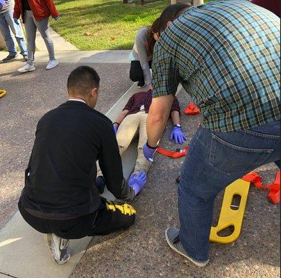 PCC EMT students participating in a trauma scenario.