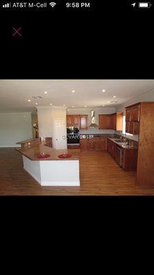 Sam house interior: kitchen cabinets, flooring and the island