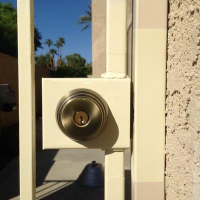 New welded-in gate box and deadbolt. Professional fabrication, primed and painted.