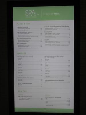 Menu of services with prices to the left of the entrance.