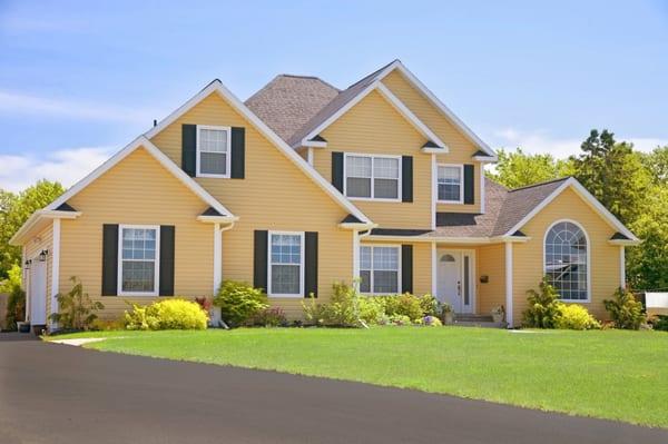 Yellow  Siding brightens up this Kansas City area home.