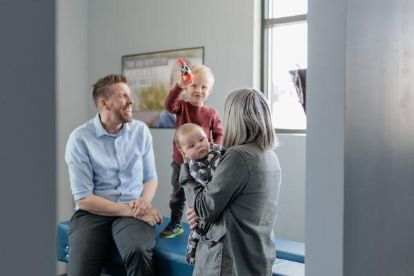 family adjusting at cadence chiropractic