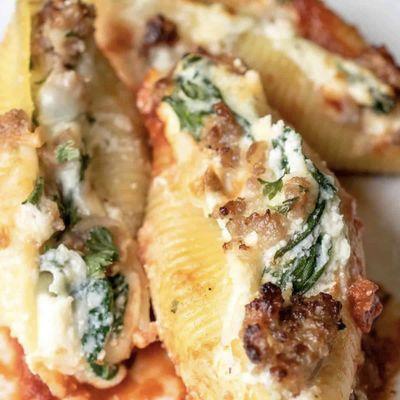 Signature Stuffed Shells with ricotta and mild Italian sausage