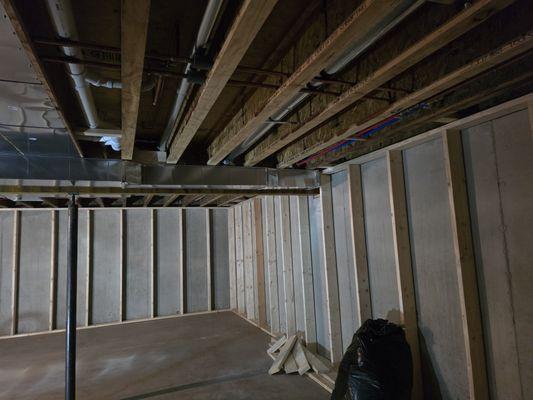 Basement finish framing walls,insulation,drywall on ceiling.