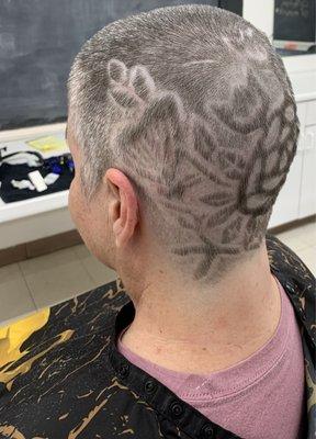 Butterfly perched on the space above the back of my left ear, more leaves, vines, flowers, and part of the rose.