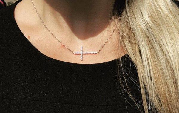 Diamond cross pendant turned into sideways necklace on a chain