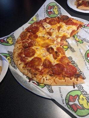 Large pepperoni pizza and cheddar pizza.