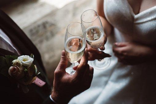 Couple touching their glasses of Champagne  for a toast