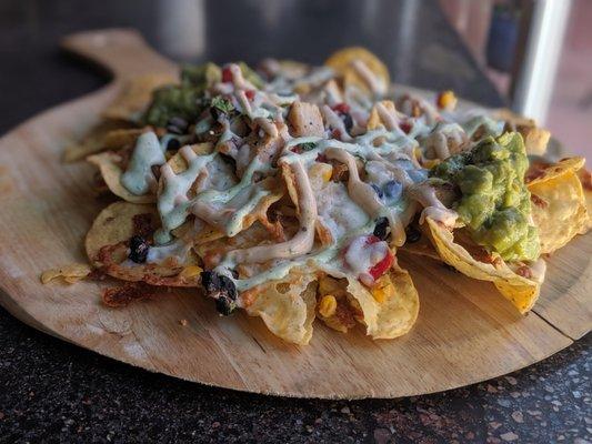 Enjoy our signature "Doubletrack Nachos" layered with chicken or brisket.