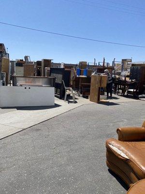 Outside has furniture, yard items and toolboxes as well as scrap wood for DIY.