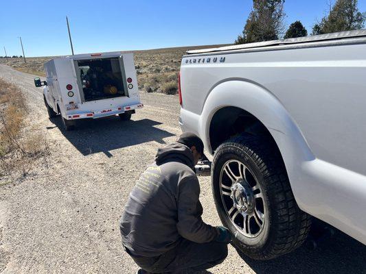 Technician TJ putting my repaired tire back on my truck.