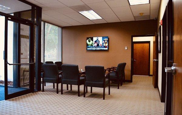 Comfortable waiting area, equipped with WiFi, beverages and entertainment for our patients!