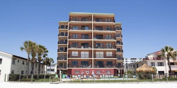 This is the back of the building. This shows the balconies coming off of each condo, the pool, and the beach.