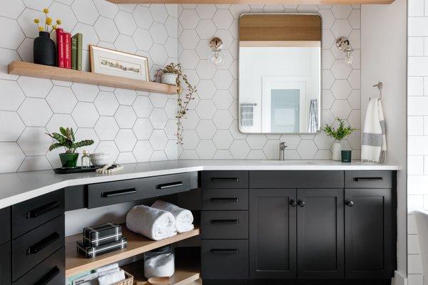 Primary vanity with additional shelves below and floating on vanity wall