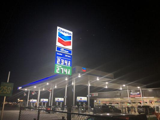 Nicely lit trendy gas station with meat and grocery!