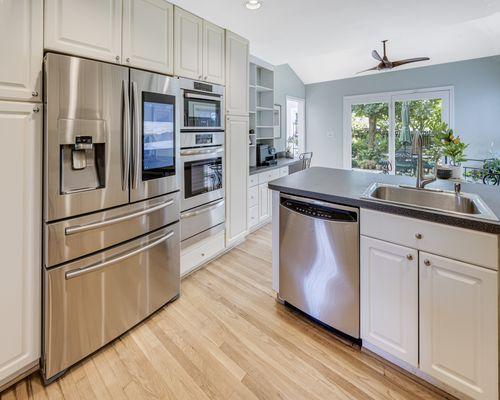 Kitchen showing refrigerator and dishwasher.