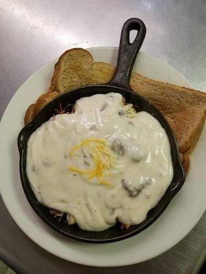 The famous Omg skillet.... Homefries,onion,eggs,sausage  and gravy.