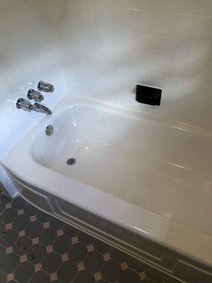 Tub and tile refinished in white.