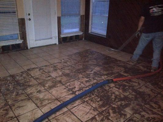 Another home with mud and debris from rising water.