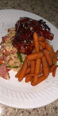 Honey Hot BBQ Chicken served with Glazed Carrots and Cajun Sausage Rice