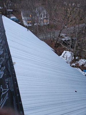 In progress corrugated metal roof.