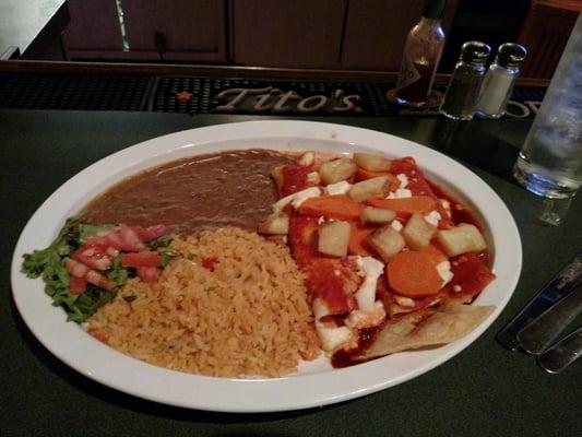 Mexican enchiladas. Center of tortillas had cold, firm, unmelted cheese.Beans were soupy. Rice over cooked. Carrots were al dente.