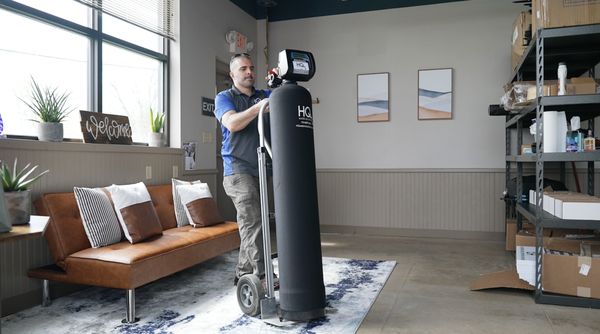 Moving a water softener inside the HQ Water Solutions shop