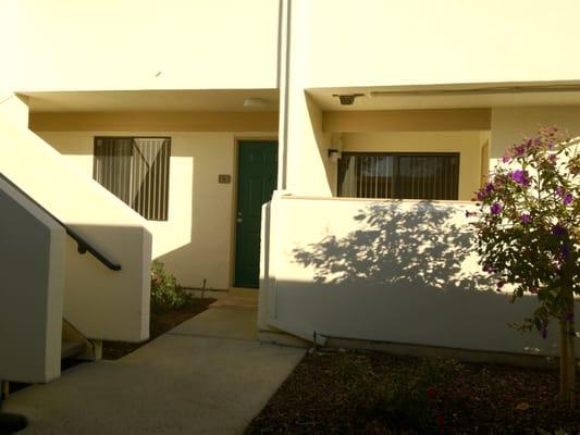 Front of apartment with patio to the right