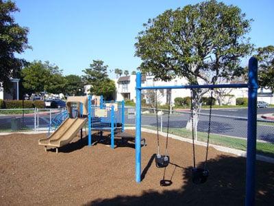 Childrens playground adjacent to basketball courts