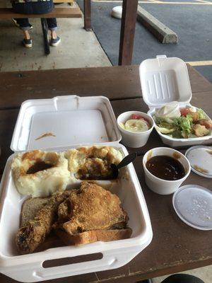 Fried chicken dark with double mashed potatoes, cucumber salad and green salad with side of gravy... BOOM I'm Stuffed....