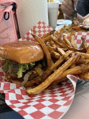 Tiger burger. Made with fresh beef hamburger, crispy bacon, grilled onions, cheese, lettuce and special sauce.