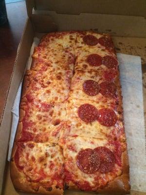 Small Sicilian pizza with half cheese, half pepperoni.