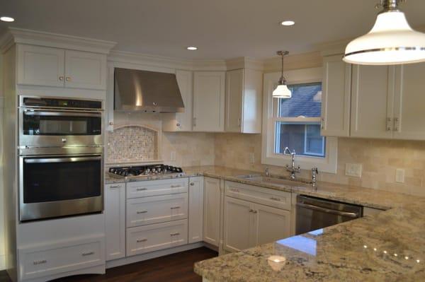 Omega Cabinets in "Oyster" with a granite counter top.