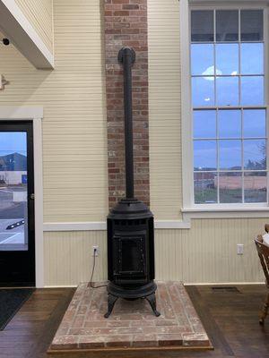 Pellet stove and restored chimney in the place of the original pot belly stove.