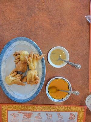 Crab ragoon with two sauces.