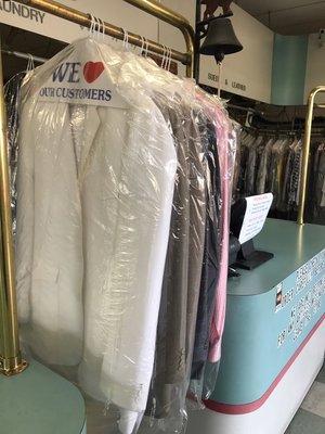 Picking up dry cleaned clothes