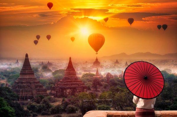 Hot-air balloons rise above the plains in majestic Myanmar