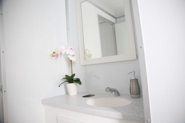 One of four sinks inside the Bob's Premium Privies shower trailer.