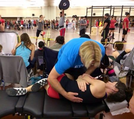 Dr. Scott on the sidelines giving care to athletes before, and after competitions.