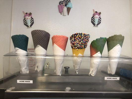 We are making homemade waffle cones this year. They can be dipped in chocolate and have rainbow or chocolate sprinkles.