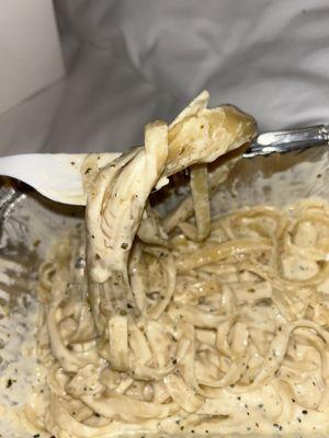 Hard clumpy Alfredo noodles and flavorless sauce