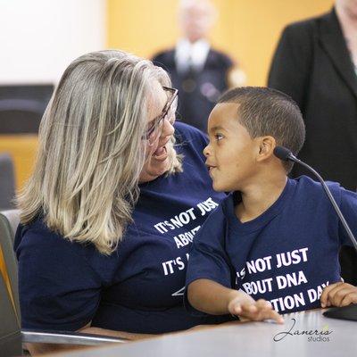 Adoption ceremony of a foster son becoming part of her family