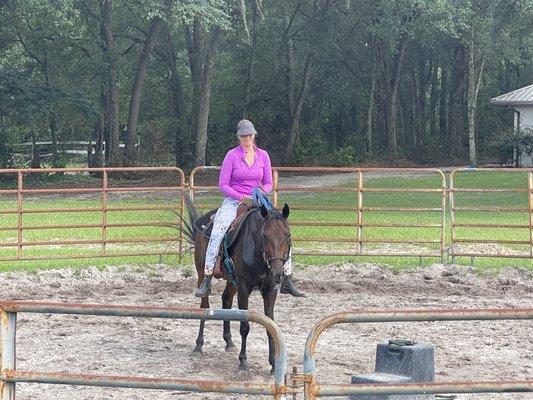 Miss Alana on a horse she's training