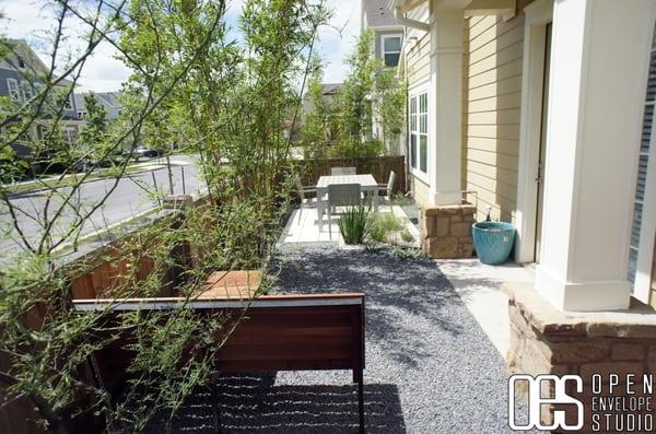 Bellaire Residence: Small space dining patio, with aggregates, custom bench, and native plants, plus clumping bamboo for privacy.