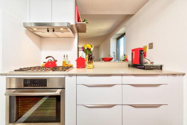 Red & White Galley Kitchen by Leicht