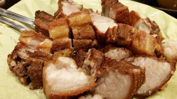 Lechon kawali. Listen for the serious crunch as you dare to try to bite into the skin.  And....dont forget the vinegar and garlic dip!