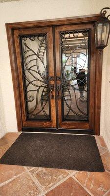 Custom Entry Door with wrought iron, double pane energy efficient glass.