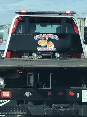 On the back of one of their tow trucks, classic