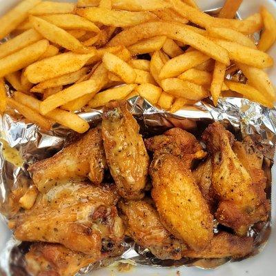 Lemon pepper wings (half wet, half dry) with fries. Food truck purchase.